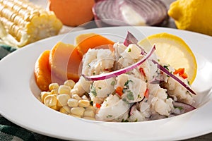 Traditional peruvian ceviche with fish, sweet potato, corn and vegetables