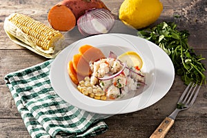 Traditional peruvian ceviche with fish, sweet potato, corn and vegetables