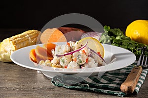 Traditional peruvian ceviche with fish, sweet potato, corn and vegetables