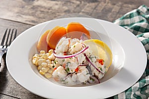 Traditional peruvian ceviche with fish, sweet potato, corn and vegetables