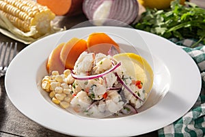 Traditional peruvian ceviche with fish, sweet potato, corn and vegetables