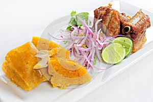 Traditional Peruvian Meal Called Chicharron de Panceta de Cerdo Served in a Restaurant. photo