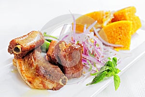 Traditional Peruvian Meal Called Chicharron de Panceta de Cerdo Served in a Restaurant. photo