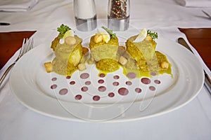 Traditional Peruvian Meal Called Ocopa Arequipena Served in a Re photo