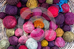 Traditional Peruvian textile dyes and colorful wool balls from natural pigments photo