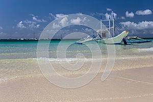 Traditional Philippine double-outrigger boat