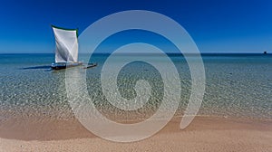 Traditional pirogue on seashore at Nosy Ve island, Anakao, Madagascar