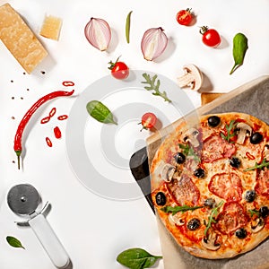 Traditional pizza preparation ingridients: parmesane, tomatoes, mushrooms, basil, ruccola, red pepper, onion, spices