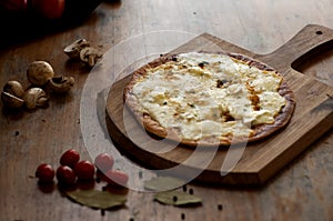 Traditional pizza with some mushroom and cherry