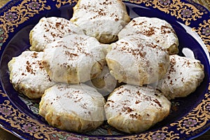 Traditional plate with fresh baked Moroccan mini bastella