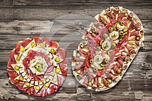 Traditional Plateful of Appetizer Savory Dishes Meze on Old Cracked Flaky Wooden Surface