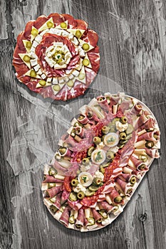 Traditional Plateful of Appetizer Savory Dishes Meze on Old Cracked Flaky Wooden Surface