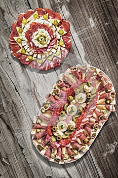 Traditional Plateful of Appetizer Savory Dishes Meze on Old Cracked Flaky Wooden Surface