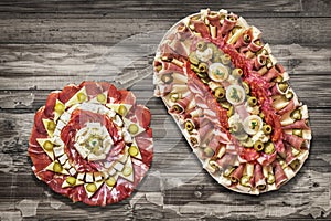 Traditional Plateful of Appetizer Savory Dishes Meze on Old Cracked Flaky Wooden Surface photo