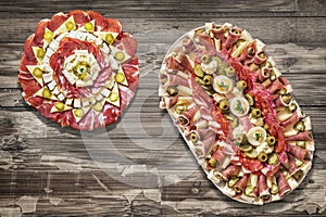 Traditional Plateful of Appetizer Savory Dishes Meze on Old Cracked Flaky Wooden Surface photo