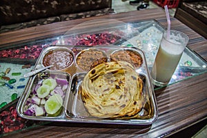 Traditional platter from Punjab (Punjabi Thali), with a glass of lassi, Amritsar, Ind