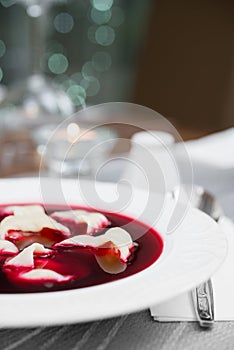 Traditional Polish beetroot soup with dumplings (red borsch)