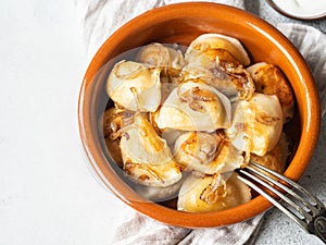 Traditional Polish dish - pierogi or dumplings or vareniki potatoes and mushrooms