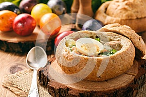 Traditional polish easter soup - zurek, served in bread loaf.