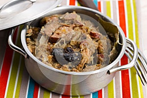 Traditional polish sauerkraut (bigos) with mushrooms and plums