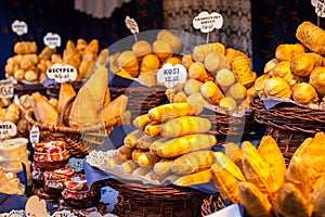 Traditional polish smoked cheese oscypek on outdoor market in Krakow, Poland.