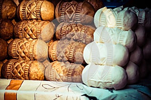 Traditional polish smoked cheese oscypek on outdoor market in Zakopane