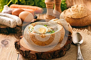 Traditional polish soup - zurek, served in bread loaf.