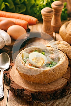 Traditional polish soup - zurek, served in bread loaf.