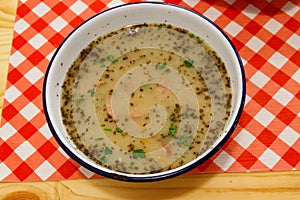 Traditional Polish soup Zurek on table