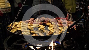 Traditional Polish street food, grilled sheep cheese at local fair on New Year's Eve and Christmas. Oscypek with
