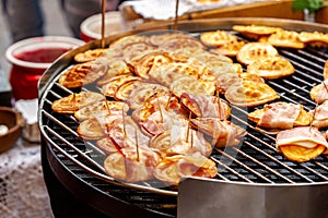 Traditional polish street food, sheep cheese, lots of smoked oscypki, delicious tasty oscypek with bacon on grill, local market