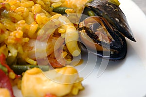 A traditional popular Spanish seafood paella dish. Mussels, Amandi and prawns on a pillow of rice.