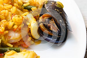 A traditional popular Spanish seafood paella dish. Mussels, Amandi and prawns on a pillow of rice.