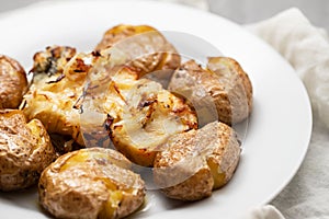 Traditional portuguese cousine, cod fish with potatoes and onions, covered with oil.