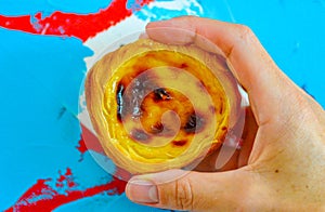Traditional Portuguese custard tart, pastel de nata, with colorful background photo