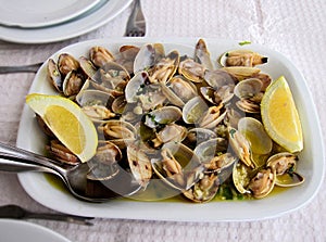 Traditional Portuguese dish, Clams with garlic, extra virgin olive oil and lemon
