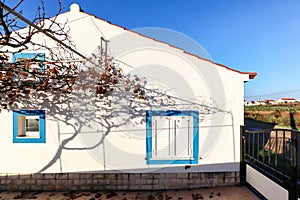 Traditional portuguese house in a small village at the Rota Vicentina - residential building in early spring, Alentejo Portugal