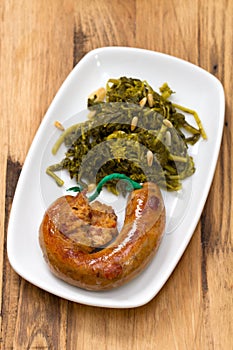 Traditional portuguese smoked sausage with turnip greens