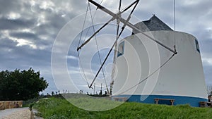 A traditional Portuguese windmill near the Algarve town of Odeceixe, Portugal. Panning upwards shot