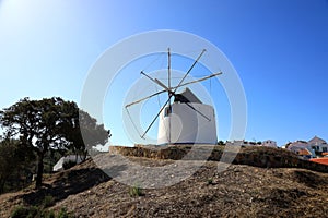 Traditional portuguese windmill near Odeceixe Aljezur, Portugal photo