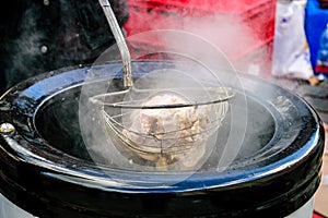 Traditional preparation of meat and soup at the Moravian pig-slaughter