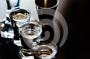 Traditional pure vodka in glasses on a black background, chilled