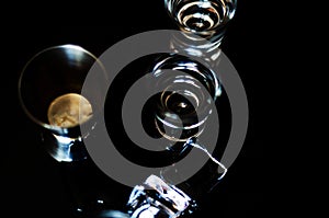 Traditional pure vodka in glasses on a black background, chilled