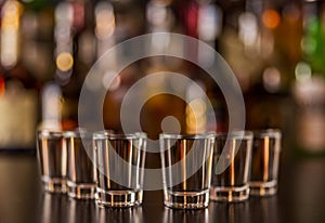 Traditional pure vodka in glasses on a black background, chilled