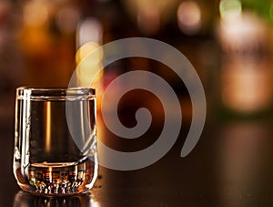 Traditional pure vodka in glasses on a black background, chilled