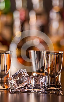 Traditional pure vodka in glasses on a black background, chilled