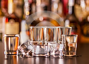 Traditional pure vodka in glasses on a black background, chilled