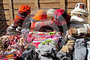 Traditional quechua colorful textil and hats photo