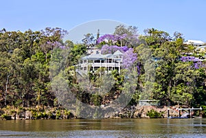 Traditional Queenslander House on the banks of river in Queensland Australia