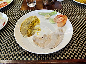 Traditional Rajasthani meal - chapati,besan gatte vegetable and roti served at Indian restaurant